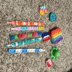5 brace lets 5 keychains one small bag all pop it items