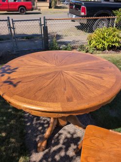 Oak dining room table and five chairs
