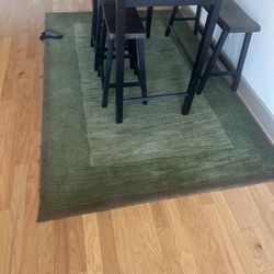 Table, chairs and rugs