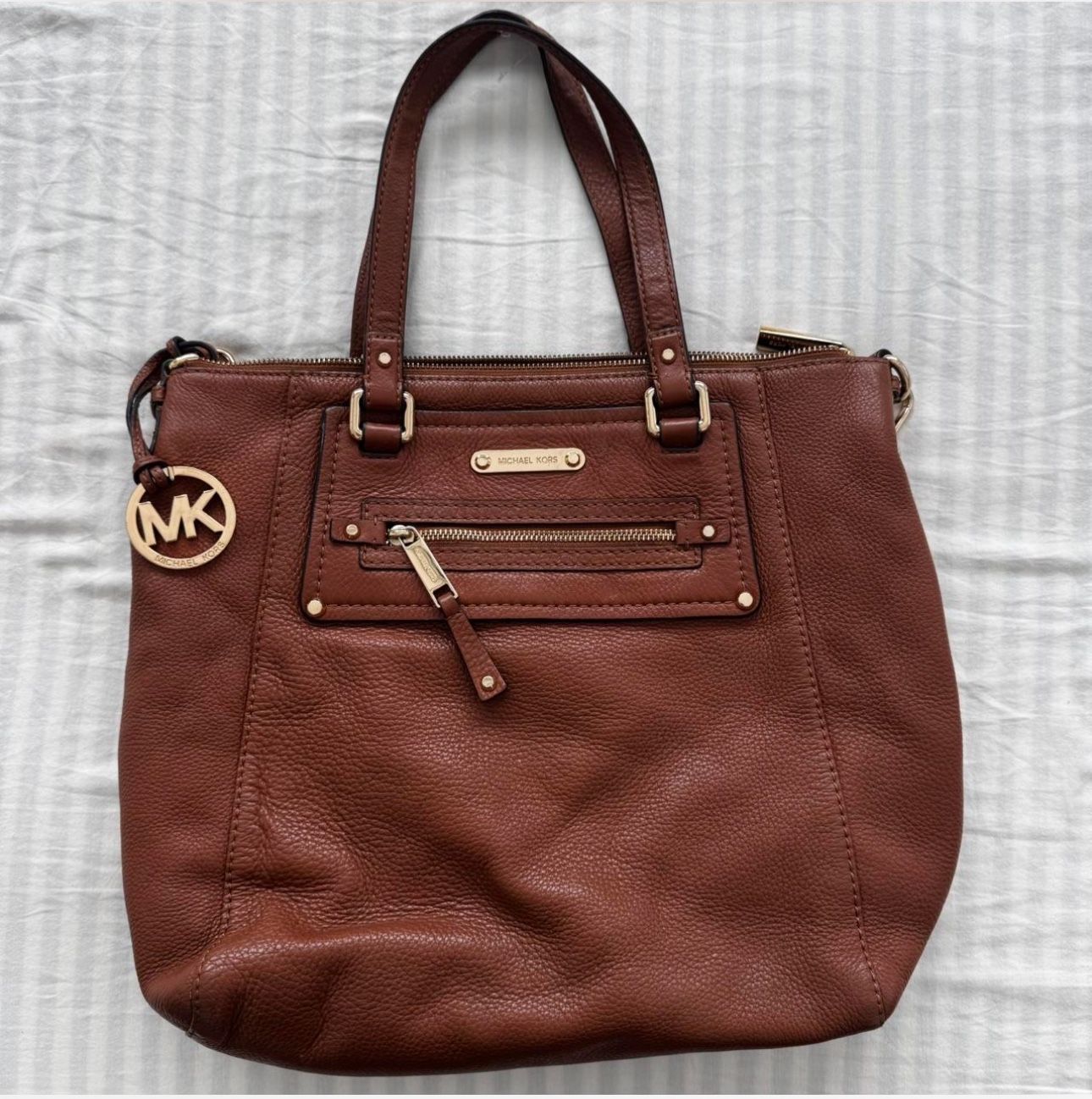 Brown Michael Kors genuine leather bag with top handle and cross body strap 