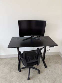 Adjustable standing desk with chair