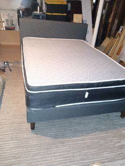 Queen bed. Frame 2 years old with strong mattress