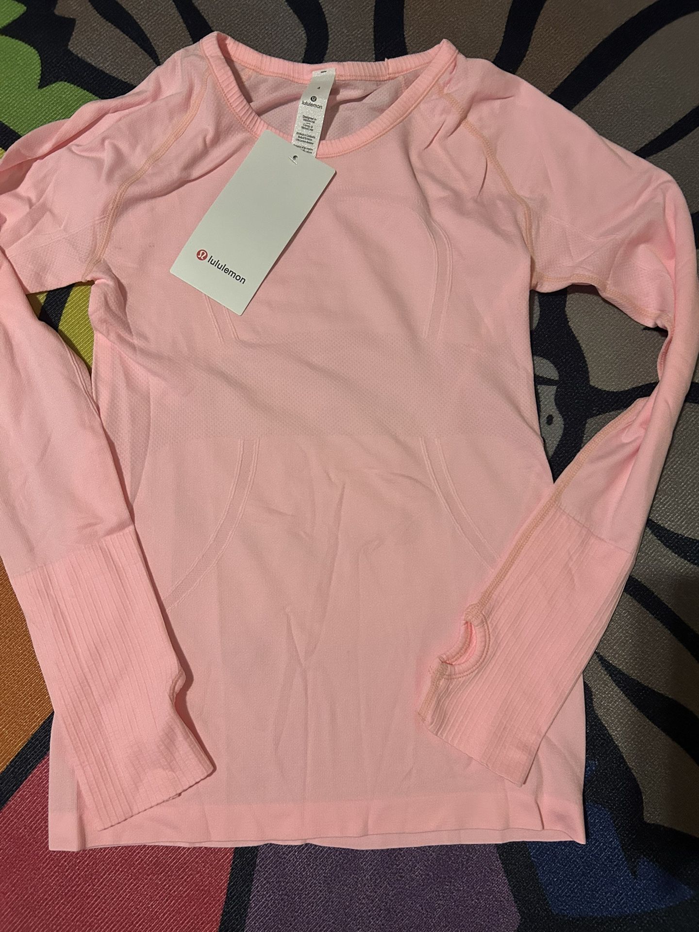 Pink Lululemon workout sweater