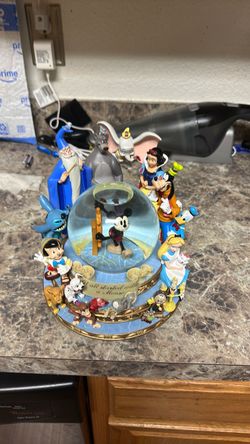 22 total Disney snow globes