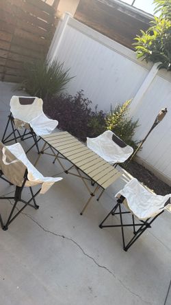 Camping table four folding chairs