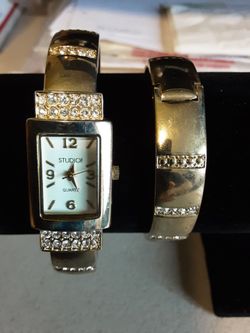 Quartz Studio women's cuff watch with sparkling crystal accents and matching bracelet