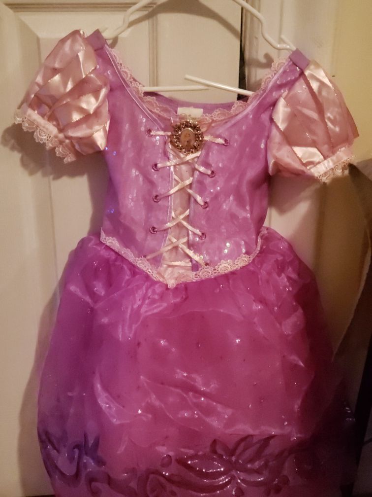 Rapunzel size: 5/6 for $10 and or batgirl size: small for $5.00