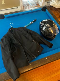 Woman’s motorcycle jacket and helmet