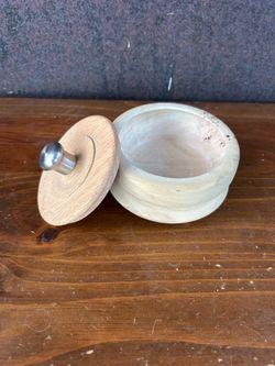 Hand-carved round wooden box with lid.