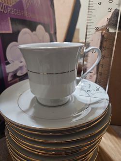 White Porcelain Cup and Saucer Set with Gold Trim