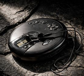 Personal CD player with radio