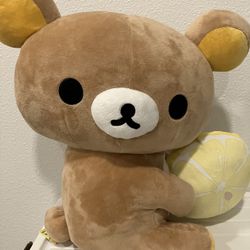Rikakuma Bear Plush holding Lemon 