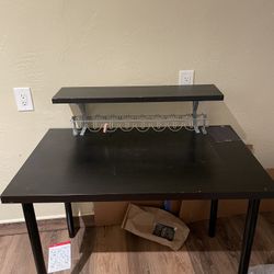 Black IKEA table with removable shelf