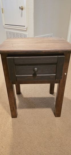 Solid wood end table/nightstand with a drawer.