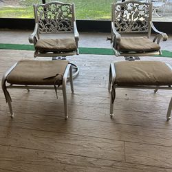 Two swivel chairs and foot stools