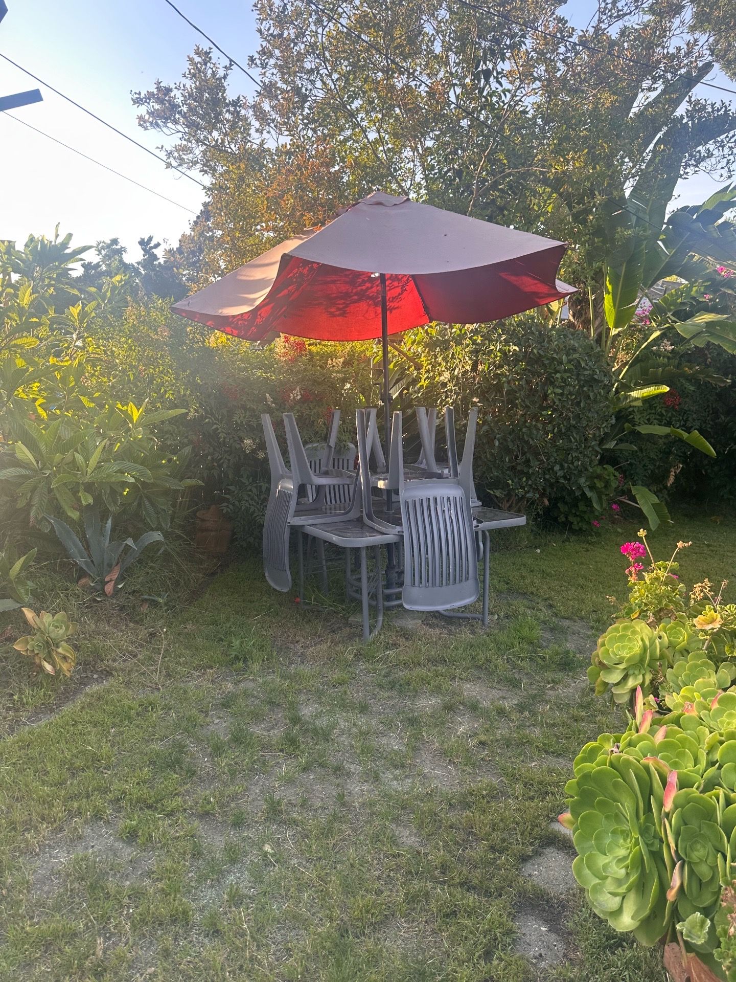 Outdoor table with four chairs and umbrella Outdoor table with four chairs and umbrella