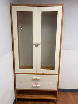 Glass shelves cabinet with drawers.
