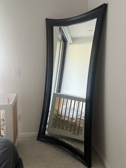 Large black framed mirror