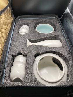 New in case, white ceramic 9 piece sake set