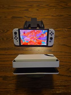 $200 - Nintendo switch with 7-in OLED screen and 64 GB internal storage