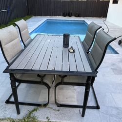 Outdoor dining table and 4  armchairs