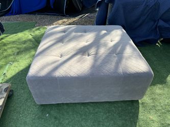 Ladlows Gray Chenille Ottoman Used For Staging