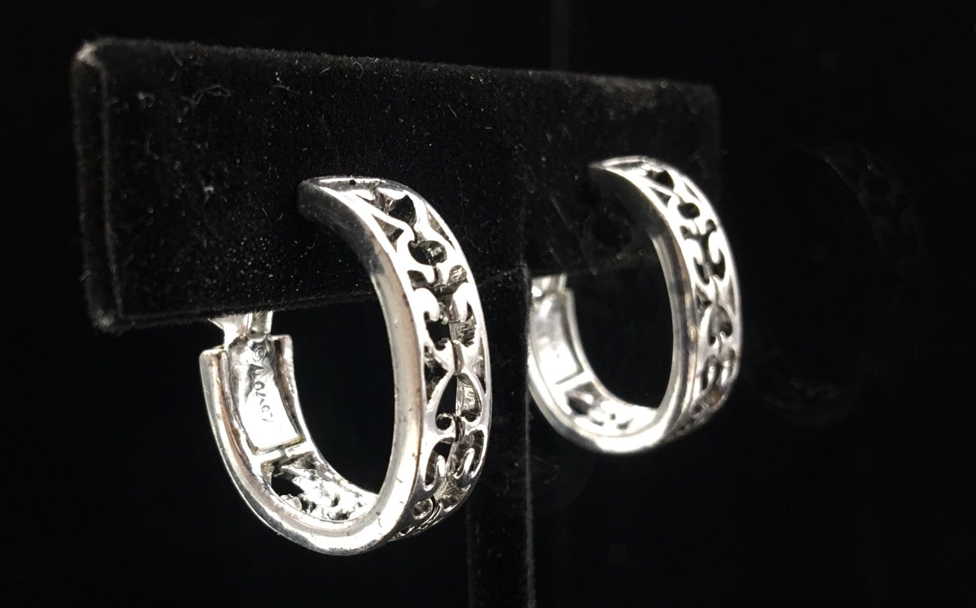 Silver tone clip on earrings signed MONET