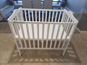 Delta Children Folding Portable Mini Baby Crib with Mattress