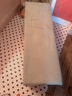 Light blue upholstered storage bench