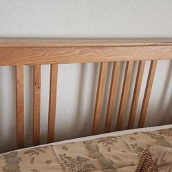 Oak Queen Bed Frame with Mattress and Boxsprings.