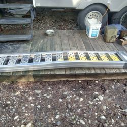 New Sturdy Set Of Aluminum, 7' Foot, 1850 Lb Capacity Loading Ramps, New Condition. $100.00.