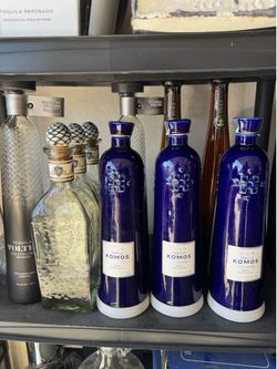 Empty Tequila Bottles and Clay Patron Cups