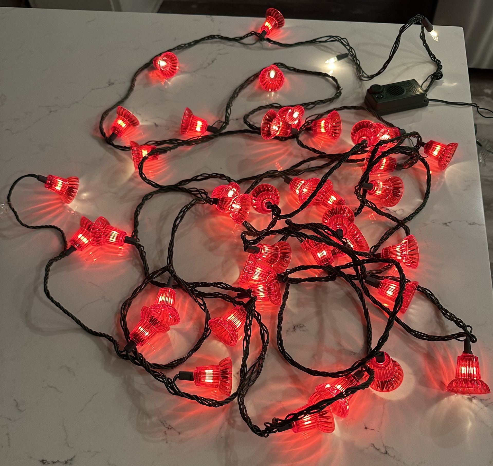 Vintage Musical String Red Bell Lights 27 feet long. Plays different Christmas Songs. Has volume control And a switch to change light pattern and tur