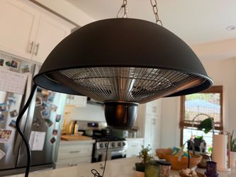 Two hanging infrared patio heaters.