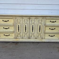 Vintage Mid-century Dresser Features Intricate Carved Detailing On The Central Cabinet Drawers.