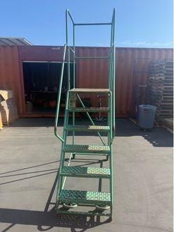 Commercial ladder seven steps seven feet high 28 inches wide