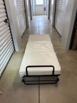 Folding Ottoman/ Rollaway Bed with Mattress