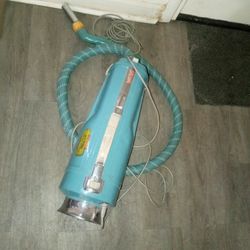 Antique Vacuum On Skates