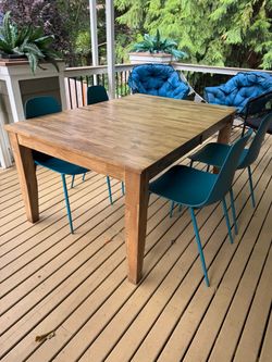 Crate and Barrel  Wood Dining Table with 4 Teal Chairs