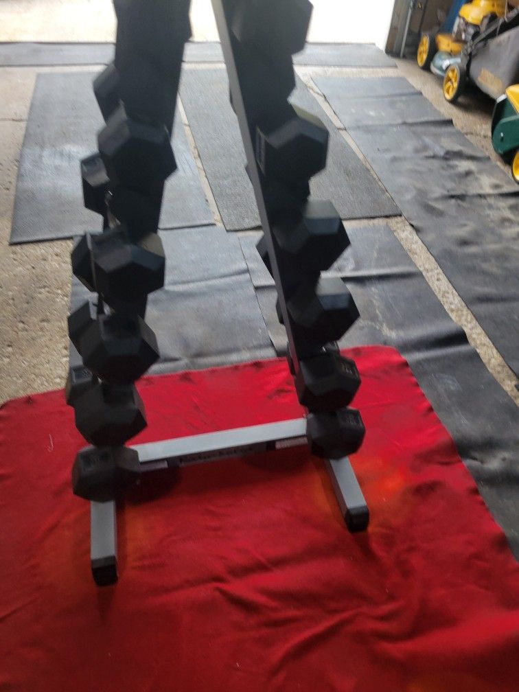 BODY SOLID   SETS. 8s.  10s. 15s  20. 25s. 30s.  RUBBER COATED HEXHEAD DUMBBELLS TOTAL 216LBs  BODY SOLID  STEEL A-FRAME DUMBBELL RACK  HOLDS 6 SETS
1