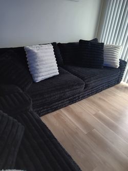 Black onyx sofa and double chase chair with black and white pillows