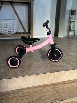 Pink kids balance bike