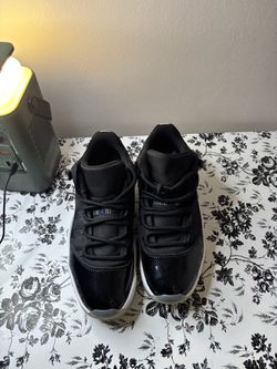 Air Jordan 11 Low Black Patent Sneakers
