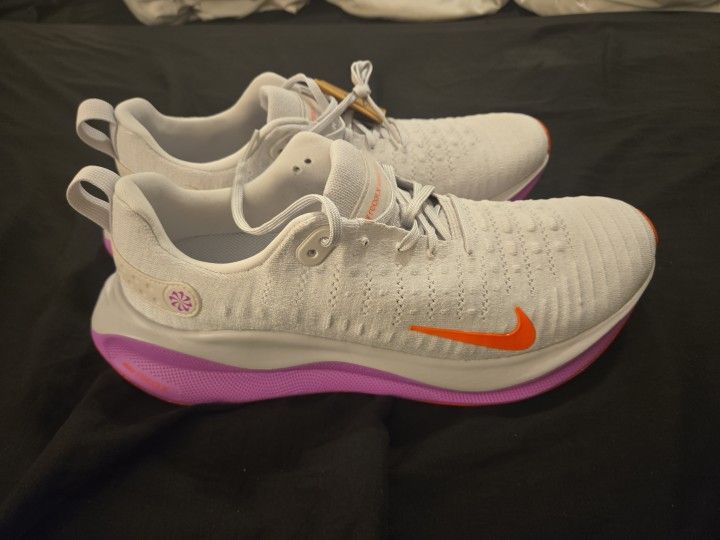 Nike InfinityRN 4 running shoes, specifically the "Vast Grey/Hyper Violet/Bright Crimson" colorway.