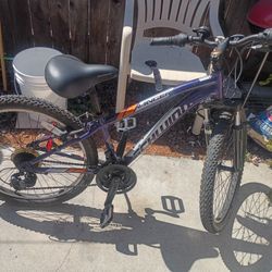 The Schwinn Ranger 24" Mountain Bike is a bike with a lightweight aluminum frame, front suspension fork, and 24 by 2.4-inch tires. It has 21-speed twi