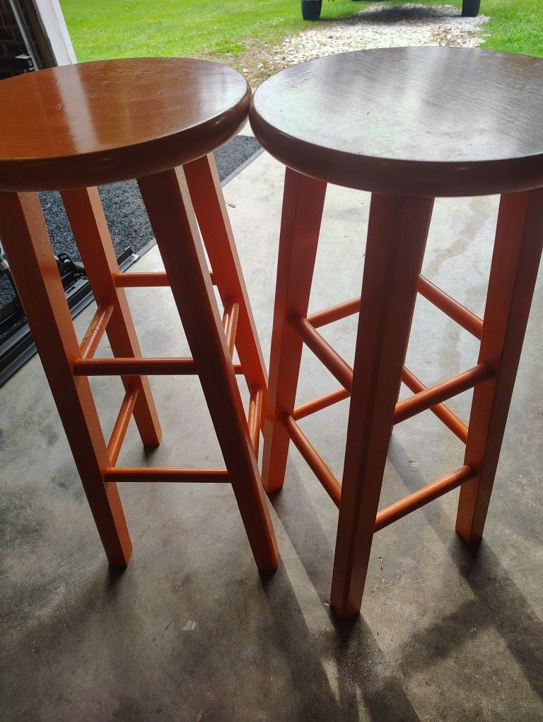Two Orange Bar Stools