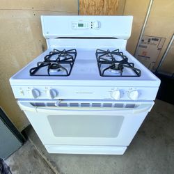 GE gas stove 4 burners white color.  30”