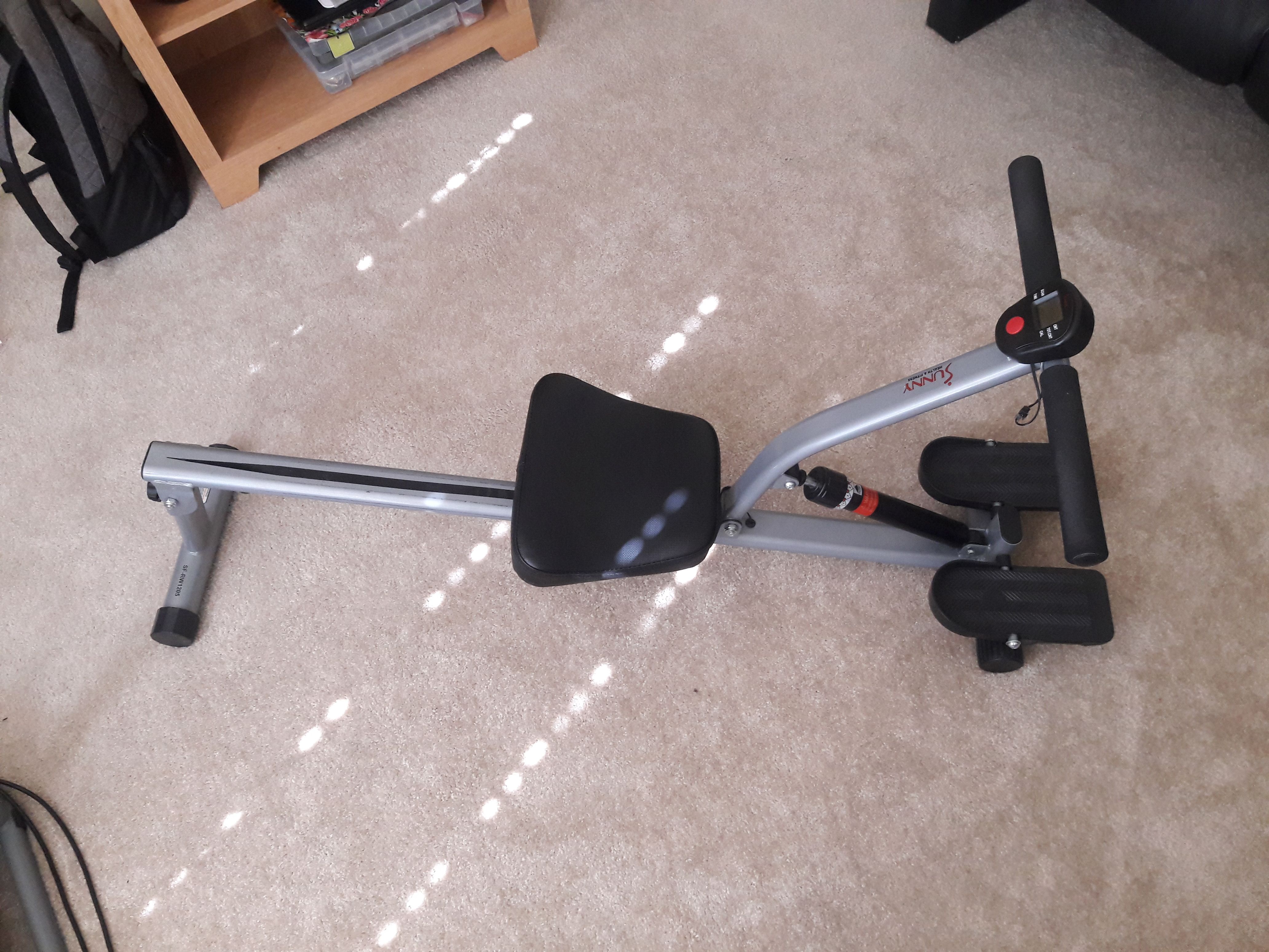 Rowing machine for legs, arms and abs