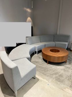 modular curved lounge set (multiple sections) + the large round wood coffee table