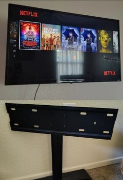 30 in TCL flat screen TV plus tv stand mount
